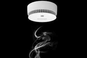 What is the difference between a smoke detector and a smoke alarm?